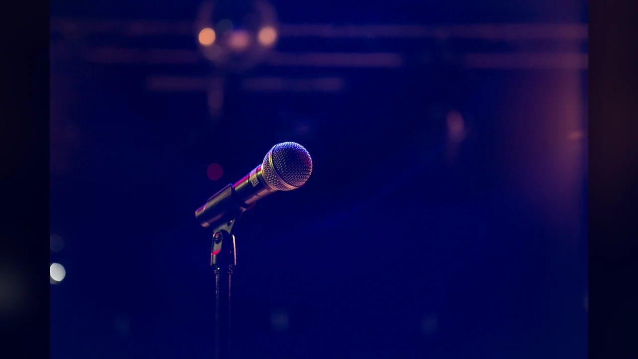 SongCoverGen instrumental cover: an empty microphone on stage, ready for karaoke